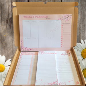 This lovely gift set with a Cherry Blossom design will warm the heart of any stationary lover or get it as a treat for yourself. The Set Contains: 1 Shopping List with 50 pages (21cm x 10cm) 1 A5 Notepad with 50 pages (15cm x 21cm) 1 A5 Weekly meal planner pad with 50 pages (15cm x 21cm) 1 A4Weekly planner with 50 pages (30cm x 21cm) Everything comes packed inside a large letter-sized box.