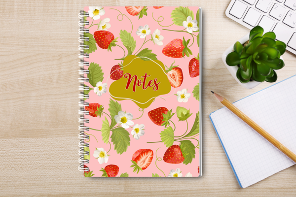 Our A4 or A5 Notebook Spiral Bound with strawberries on the cover is handmade by a small business in Ballachulish, Scotland. The cover is printed on 300gsm glossy paper and the notebook has 75 lined pages inside (so 150 pages for you to write on).