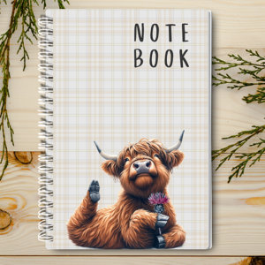 Our A4 or A5 Notebook with a Highland Cow Holding a Thistle Flower on the cover is handmade by a small business in Ballachulish, Scotland.